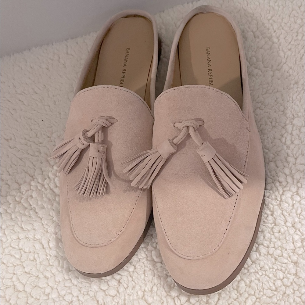 Super classy slip on mule with tassels.  Worn once